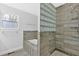 Spa-like bathroom featuring a bathtub, a glass block wall, and modern fixtures at 3640 Silver Leaf Sw Ln, Marietta, GA 30008