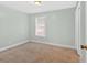 This is a bedroom featuring neutral paint and carpeting plus a window that provides natural light at 3640 Silver Leaf Sw Ln, Marietta, GA 30008