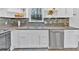 Modern kitchen with stainless steel appliances, white cabinets, and plenty of counter space at 3640 Silver Leaf Sw Ln, Marietta, GA 30008