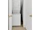 A stacked washer and dryer are conveniently placed between doorways at 3640 Silver Leaf Sw Ln, Marietta, GA 30008