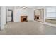 This is a living room with a decorative fireplace and washer and dryer in the background at 3640 Silver Leaf Sw Ln, Marietta, GA 30008