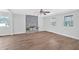 Spacious living room features a decorative fireplace, lots of natural light, and wood-look tile floors at 3640 Silver Leaf Sw Ln, Marietta, GA 30008