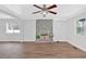 Bright living room features hardwood floors, a decorative fireplace, and ample natural light at 3640 Silver Leaf Sw Ln, Marietta, GA 30008