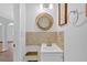Updated powder room features stylish mirror, tiled backsplash, and vanity at 3640 Silver Leaf Sw Ln, Marietta, GA 30008