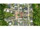 Aerial view showcasing the community's layout, tree coverage, and proximity to nearby amenities and attractions at 11277 Serenbe Ln, Chattahoochee Hills, GA 30268