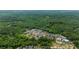 A high aerial view of 11277 Serenbe Ln showcasing its location among trees at 11277 Serenbe Ln, Chattahoochee Hills, GA 30268