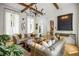 Well-appointed living room featuring hardwood floors, comfortable seating, custom shelving, and natural lighting at 11277 Serenbe Ln, Chattahoochee Hills, GA 30268