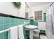 Charming bathroom with vintage green tile, a pedestal sink and a window at 1383 Fenway Cir, Decatur, GA 30030
