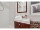 Modern bath with stand up shower, nice vanity and mirror with small window at 1383 Fenway Cir, Decatur, GA 30030