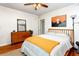 Comfortable bedroom featuring wood floors, dresser, bed and decor at 1383 Fenway Cir, Decatur, GA 30030