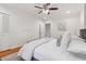 Neutral bedroom with hardwood floors, ceiling fan, and two windows with neutral decor at 1383 Fenway Cir, Decatur, GA 30030