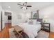 Neutral bedroom with hardwood floors, ceiling fan, two windows and neutral decor at 1383 Fenway Cir, Decatur, GA 30030