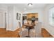 Charming dining area open to the kitchen, featuring hardwood floors and natural light at 1383 Fenway Cir, Decatur, GA 30030