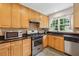 Functional kitchen with stainless steel appliances, granite countertops, and ample cabinetry at 1383 Fenway Cir, Decatur, GA 30030