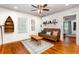 Cozy living room with hardwood floors, a futon, and natural light with view to another room at 1383 Fenway Cir, Decatur, GA 30030
