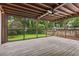 Inviting screened-in porch showcasing wood floors and tranquil backyard views at 1383 Fenway Cir, Decatur, GA 30030