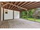Large screened-in porch featuring wood ceiling, ceiling fan, and views of lush greenery at 1383 Fenway Cir, Decatur, GA 30030