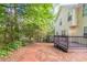 Relax on the wooden deck overlooking the lush backyard, offering privacy and tranquility at 3732 Landgraf Cv, Decatur, GA 30034