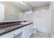 The bathroom offers a combination of a dark vanity and a white tile shower and toilet at 3732 Landgraf Cv, Decatur, GA 30034