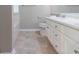 Bright bathroom featuring a white vanity, toilet, and tiling at 3732 Landgraf Cv, Decatur, GA 30034