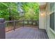Enjoy outdoor living on this wood deck, surrounded by lush trees and a peaceful setting at 3732 Landgraf Cv, Decatur, GA 30034