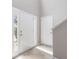 Bright foyer with neutral walls, tile flooring, and natural light streaming through the front door's sidelight at 3732 Landgraf Cv, Decatur, GA 30034