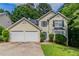 Charming two-story home featuring a two-car garage and well-maintained front yard, perfect for Gathering living at 3732 Landgraf Cv, Decatur, GA 30034