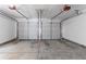 A spacious two-car garage with overhead doors and a concrete floor, ready for parking and projects at 3732 Landgraf Cv, Decatur, GA 30034