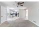 Open-concept living area connecting to the kitchen, featuring neutral carpet and ample space for entertaining at 3732 Landgraf Cv, Decatur, GA 30034