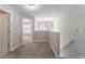 Upstairs hall with carpet flooring and open sightlines to nearby rooms at 3732 Landgraf Cv, Decatur, GA 30034