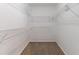 Walk-in closet with carpet flooring and metal shelving for optimal storage solutions at 3732 Landgraf Cv, Decatur, GA 30034