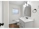 Bright bathroom featuring modern vanity, updated lighting, and black hardware accents at 4651 Palm Dr, Douglasville, GA 30135