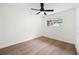 Bright bedroom with hardwood flooring, a ceiling fan, and large window with backyard view at 4651 Palm Dr, Douglasville, GA 30135