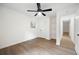 Bedroom boasting hardwood floors, natural light, a closet, and a white door at 4651 Palm Dr, Douglasville, GA 30135