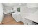 Well-lit kitchen with white cabinets, stainless steel appliances, and an open layout at 4651 Palm Dr, Douglasville, GA 30135