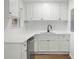 The updated kitchen has white cabinets, backsplash, and stainless steel appliances at 4651 Palm Dr, Douglasville, GA 30135