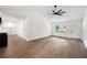 Spacious living room open to the kitchen, featuring hardwood floors and bright lighting at 4651 Palm Dr, Douglasville, GA 30135
