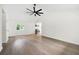Open living room with vaulted ceilings, hardwood floors, and a ceiling fan at 4651 Palm Dr, Douglasville, GA 30135
