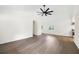 Open-concept living room with hardwood flooring, a ceiling fan, and plenty of natural light at 4651 Palm Dr, Douglasville, GA 30135