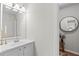 A modern bathroom featuring a contemporary mirror, floating vanity, and sleek design at 1062 Sasha Ln, Roswell, GA 30075