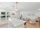 Open kitchen flows to a living space with new lighting and breakfast bar at 1062 Sasha Ln, Roswell, GA 30075