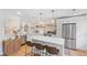 Bright kitchen featuring an island with a quartz countertop and stainless steel appliances at 1062 Sasha Ln, Roswell, GA 30075
