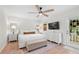 Large main bedroom featuring a ceiling fan, natural light, and walk out to backyard at 1062 Sasha Ln, Roswell, GA 30075