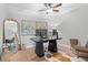 A stylish home office featuring modern decor and a dedicated workspace for enhanced productivity at 1062 Sasha Ln, Roswell, GA 30075