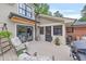 Inviting back deck with seating area, grill, and access to the screened-in porch and backyard at 236 Ridge Nw Ave, Marietta, GA 30064