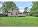 Spacious backyard showing the home's exterior, deck, lawn, and landscaping at 236 Ridge Nw Ave, Marietta, GA 30064