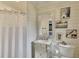 Stylish bathroom with wainscoting, a mirrored vanity, and decorative artwork creates a tranquil atmosphere at 236 Ridge Nw Ave, Marietta, GA 30064