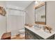Cozy bathroom with a wood-framed mirror, a white countertop, and natural-toned flooring at 236 Ridge Nw Ave, Marietta, GA 30064