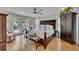 Bright bedroom featuring a large bed, hardwood floors, ceiling fan, closet and deck access at 236 Ridge Nw Ave, Marietta, GA 30064