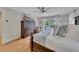 Bright bedroom with a dresser, TV, ceiling fan, hardwood floors, and deck access at 236 Ridge Nw Ave, Marietta, GA 30064